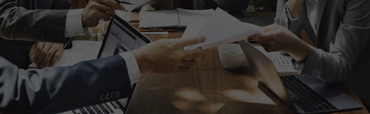 people exchanging documents