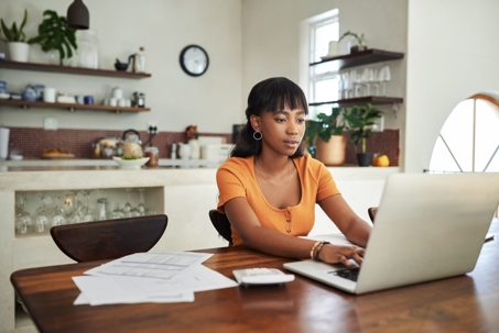 Woman going over finances at home