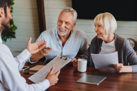 Elderly couple speaking to an attorney